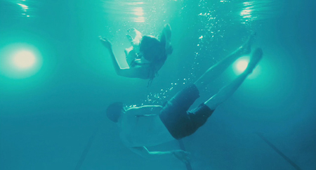 Luke Kirby and Michelle Williams underwater in "Take this Waltz" Luke Kirby and Michelle Williams underwater in "Take this Waltz"